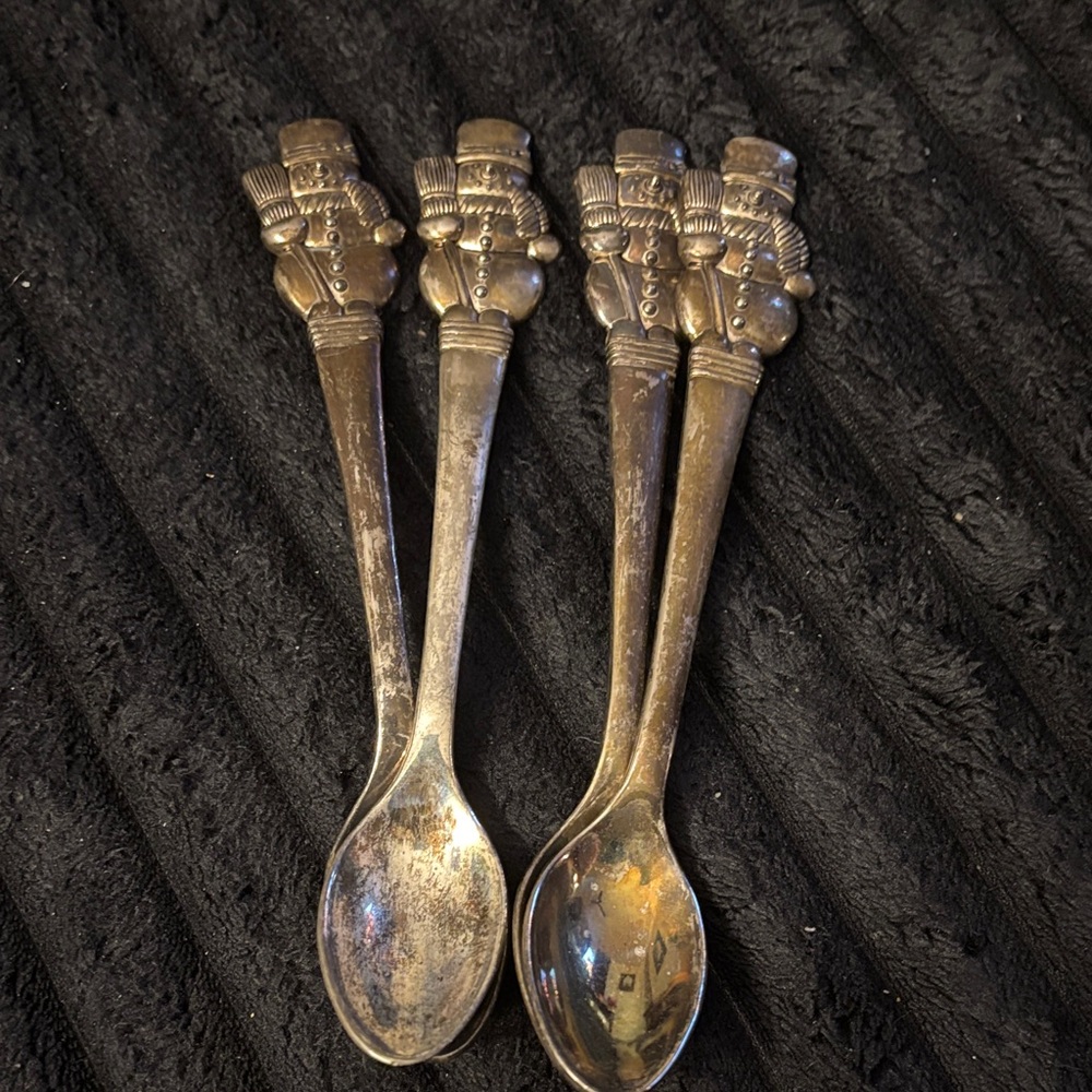 Elegant Silver Spoon Set with Intricate Design
